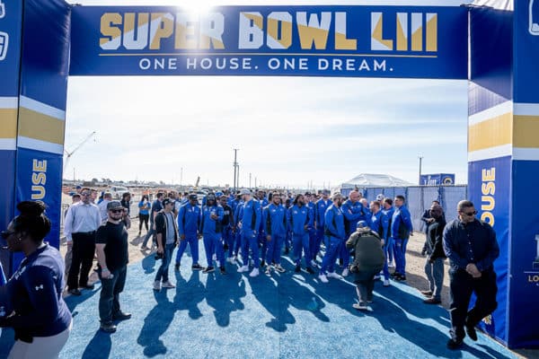 LA Rams NFL football team under blue and gold large-scale print that says "Super Bowl LIII"