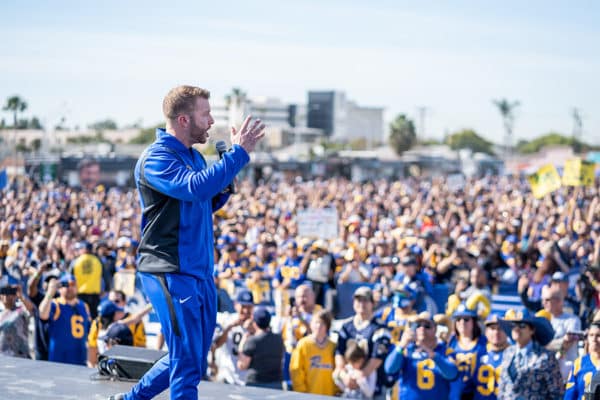 LA Rams football player speaks to fans at experiential marketing event before NFL game
