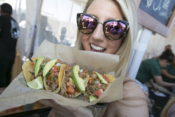Woman holding Tacos at San Diego Taco Fest experiential marketing event