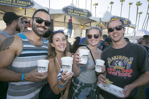 People holding Promotional Items at San Diego Taco Fest marketing event in California