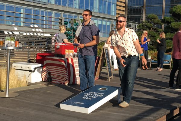 fans play corn hole at Russell Wilson Happy Hour experiential marketing event in Los Angeles