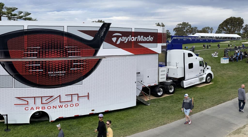 Experiential marketing - brand activation event in Los Angeles, California - TaylorMade portable driving range with 'Stealth Carbonwood' golf club large-printed promotional banner