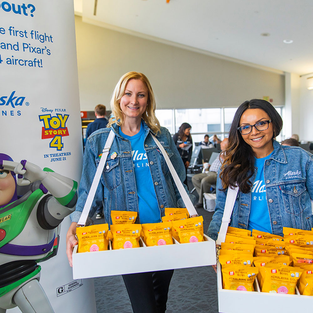 Event staff passing out product samples at experiential marketing event in Los Angeles, CA