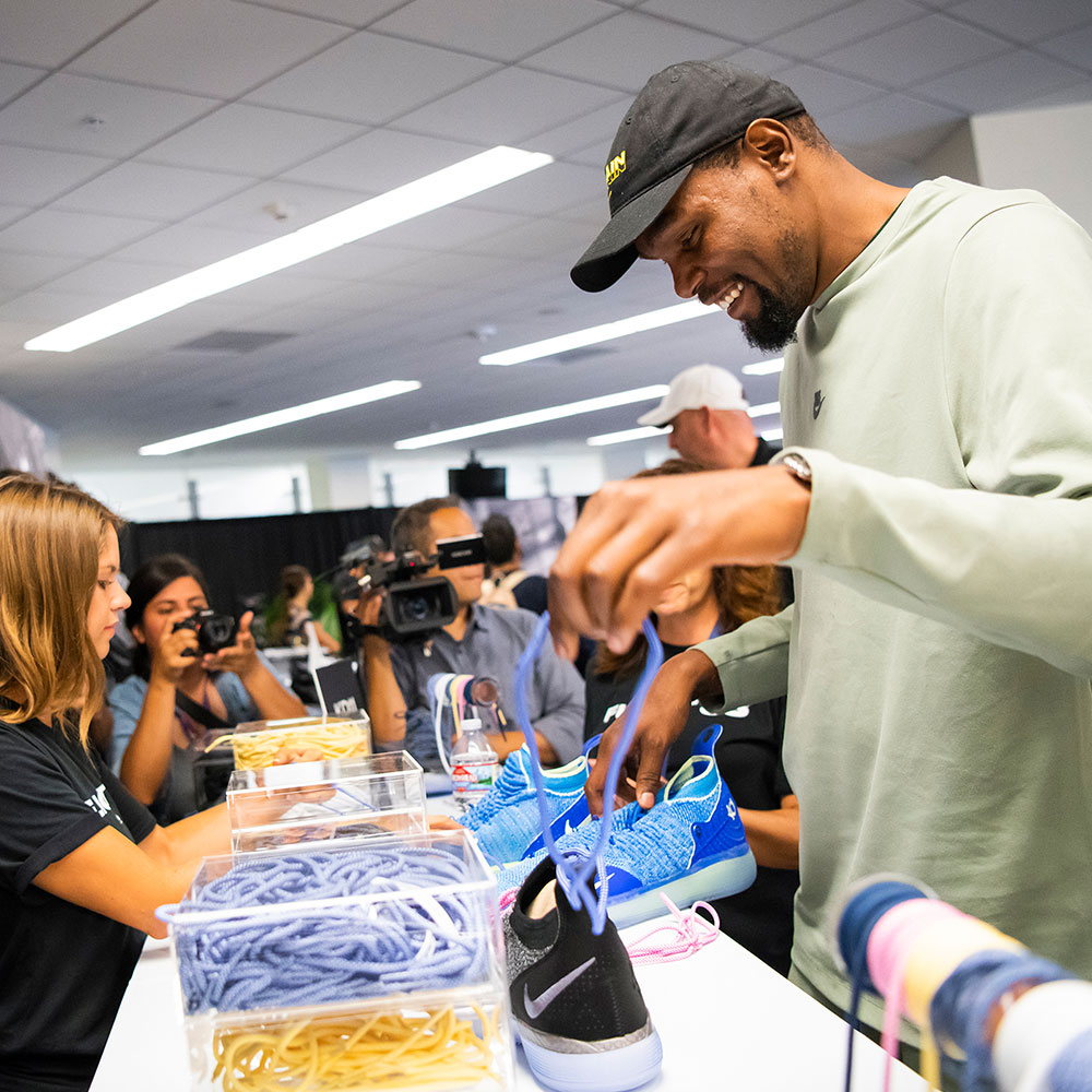 Kevin Durant helps fans lace exclusive nikes at VIP experience for Alaska Airlines Flight 35