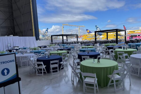 Large area of tables for seating at brand event