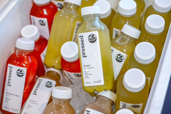 Variety of bottled juices in cooler