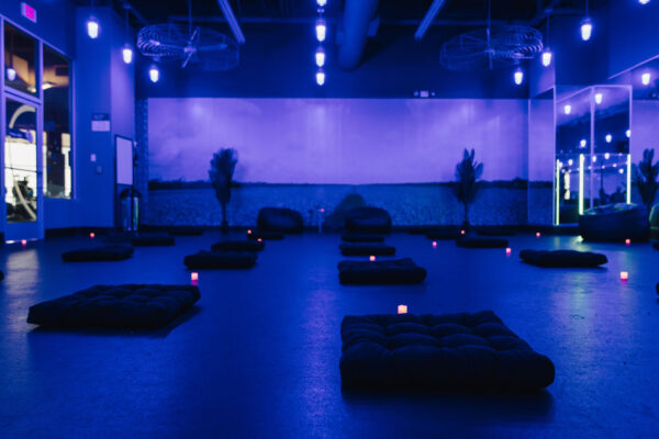 Overview of yoga room in purple light