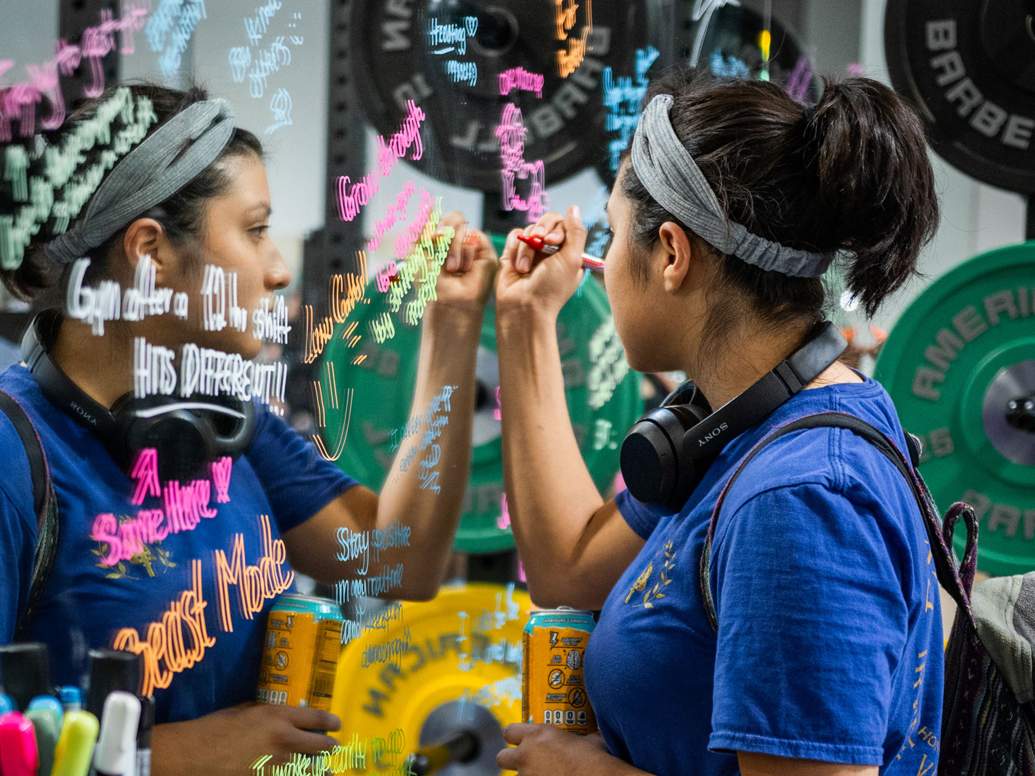 Woman writing inspirational message on mirror