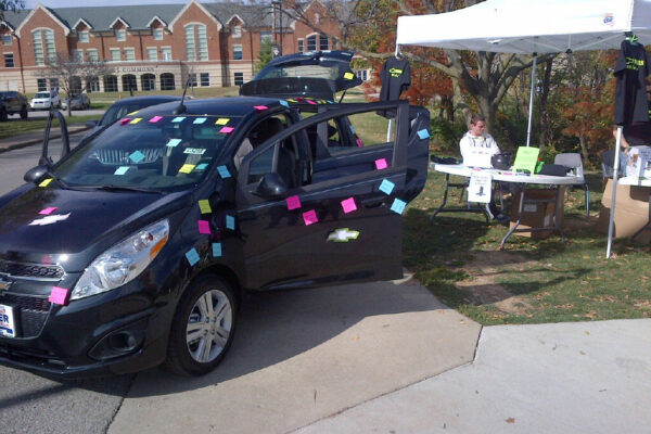 Car with notes at college event
