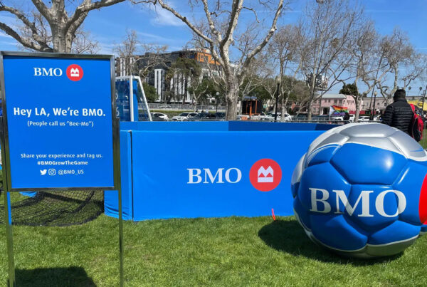 Branded festival environment with interactive fan zones, live entertainment, and sponsor signage for BMO